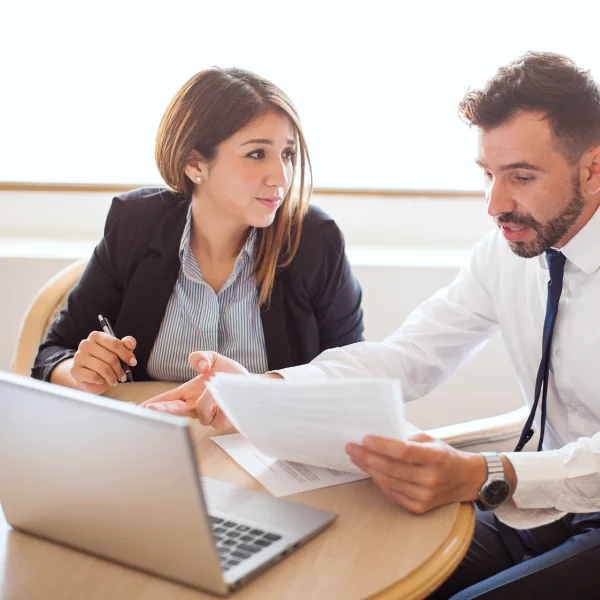 A photograph showing a person reviewing contractor profiles and reviews online.